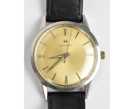 A Hamilton manual wind, gents, stainless steel wristwatch, having a champagne dial with centre seconds and baton marker and o