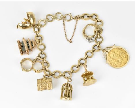 A 9ct yellow gold charm bracelet, with various hanging charms, to include a carousel, bird's cage, treasure chest, pagoda, ri