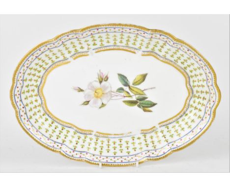 An early 19th century Nantgarw porcelain oval dish, with  lobbed border, the centre with hand painted white evergreen rose, i