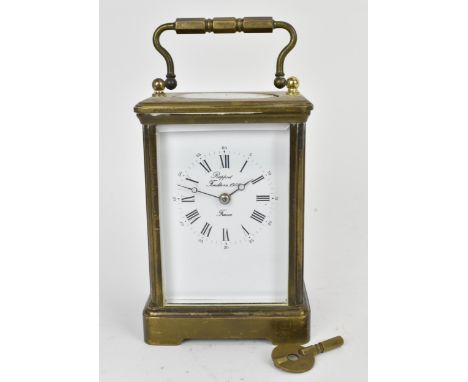 An early/mid 20th century brass cased carriage clock, white enamel dial signed 'Rapport Fondee en 1900 France' with Roman num