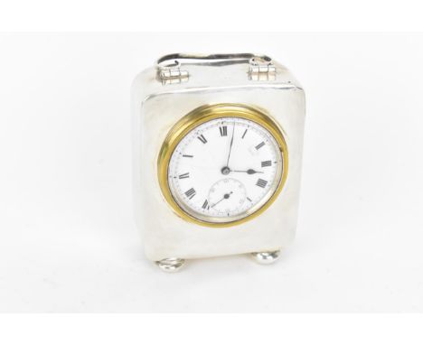 An early 20th century miniature silver cased carriage clock, the case having scroll handle with turned feet, marks rubbed, th