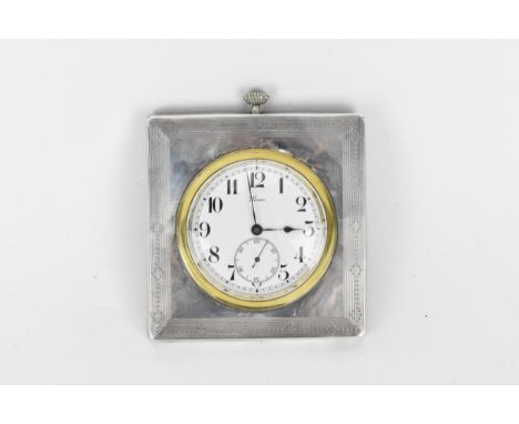 An early 20th century silver cased bedside/travel clock, the winding crown mounted to the top of the frame, machine turned bo