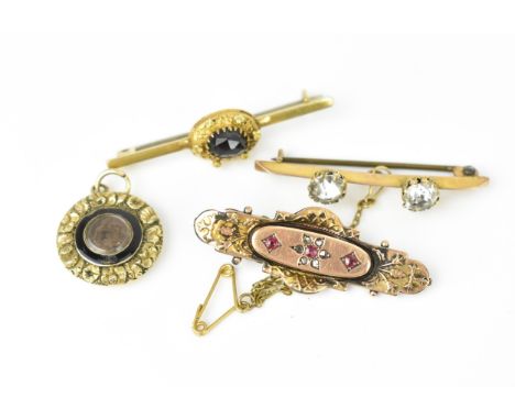 A Victorian yellow metal and enamel mourning pendant with braided hair to the centre and personalised message to the reverse,