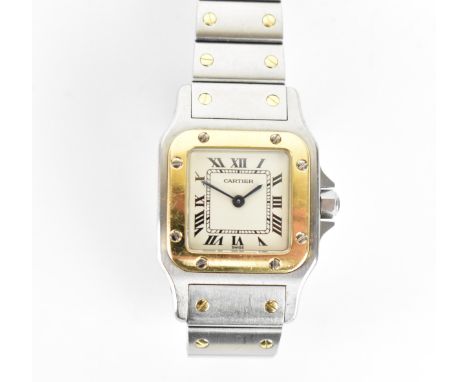 A Cartier, Santos, ladies/unisex bi-metal wristwatch, having a signed white enamel dial with Roman numerals, gold coloured be
