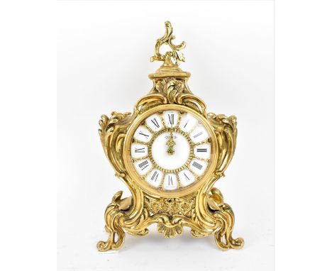 A mid/late 20th century Jaeger Electronic Lic-Ato mantle clock, the gilt metal case in the Louis XV style, the white enamel d