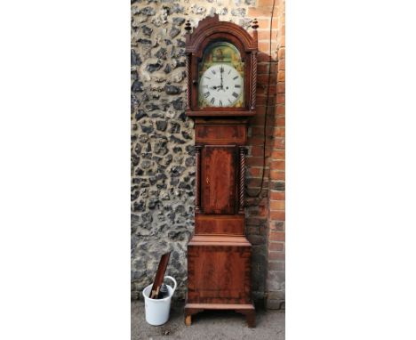 A George III mahogany longcase clock having an arched top with turned finials, twin columns flanking the arched top painted d