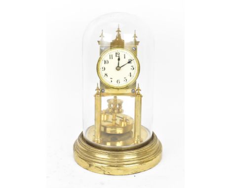 A circa 1900 Gustav Becker 400 day brass anniversary clock under a glass dome, having turned finials and enamel dial with Ara