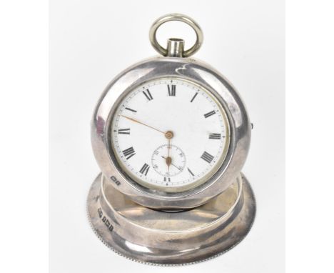 An early 20th century open faced pocket watch having a white enamel dial, with gilt hands, Roman numerals and subsidiary seco