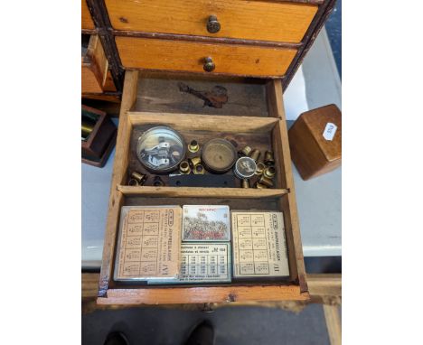 A vintage watchmakers chest of fourteen drawers containing Bergeon rotary drills, screwdrivers, Bergeon pierced brass plugs a