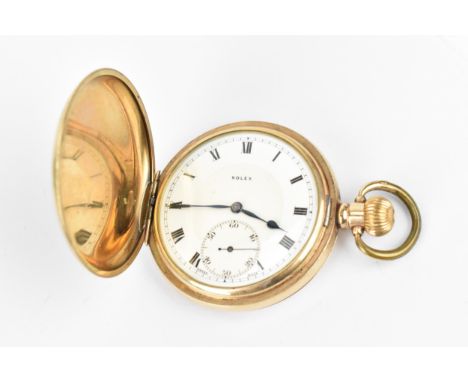 An early 20th century Rolex gold plated, full hunter pocket watch having a white enamel dial with Roman numerals, blued hands