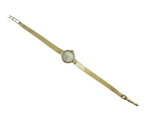 A Tissot manual wind, ladies 9ct gold wristwatch, the dial having baton markers and signed Tissot, 9ct gold bracelet and clas