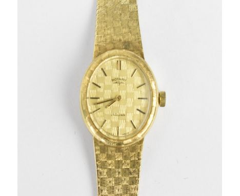 A Rotary manual wind, ladies 9ct gold wristwatch having a gilt dial with baton markers and integral chequered 9ct gold bracel