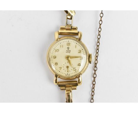 A Tudor Royal manual wind, ladies 9ct gold cased wristwatch having a white enamel dial signed Tudor Royal, with gilt Arabic n
