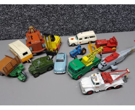 A total of 12 vintage diecast vehicles, of which 6 are by Dinky. (Porsche 356, Field artillery tractor, caravan, heavy tracto