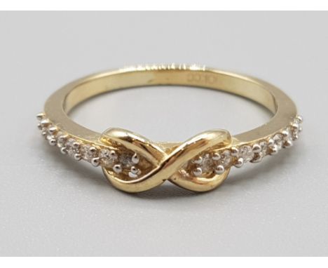 Brand new ex display 10ct gold &amp; white stone infinity pattern ring, size R, 2.5g gross