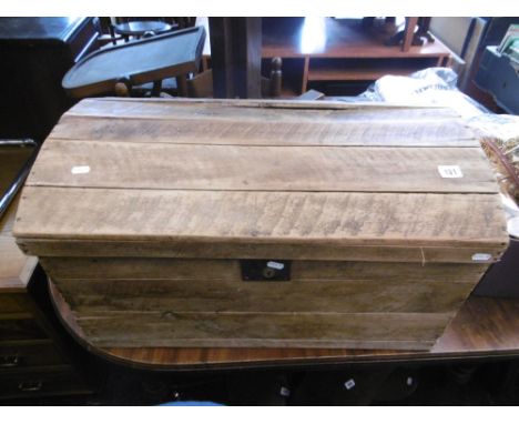 A WOODEN DOME TOP TRUNK