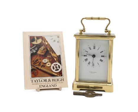 20th Century brass cased carriage clock, the white dial inscribed 'Taylor of Bligh, England' with instruction booklet and win