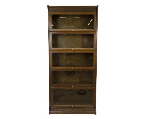 5 Tier stacking lawyers graduated bookcase, unmarked but attributed to Globe Wernicke, c1900. Oak frame with up and over glaz