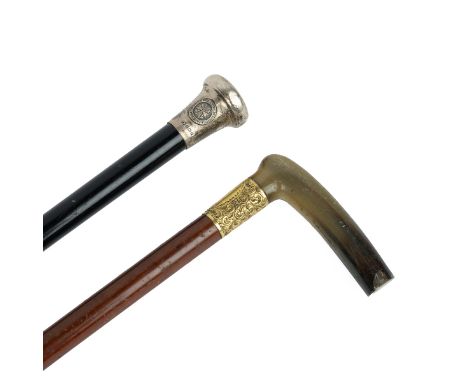 A silver topped ebonised walking cane, the knob hallmarked for Birmingham 1939 and inscribed 'Presented to P Beaumont Esq by 