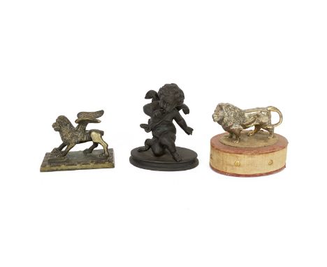 19th century bronze model of a winged mythical beast. Feet on an open book and standing on rectangular base. Also an early 20