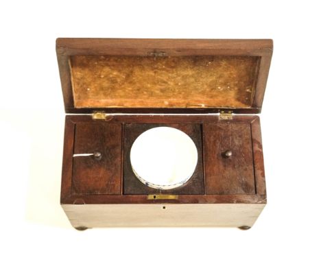 A Georgian mahogany tea caddy of sarcophagus form, the interior with lidded compartments and a Masons china bowl
