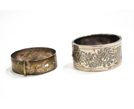 A silver bangle by Charles Horner, Chester 1945 and a Victorian broad bangle engraved with scrolling leaves and ferns 