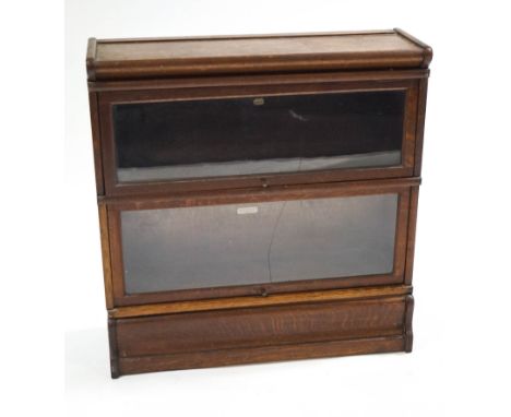 A Globe Wernicke oak two section bookcase, with original label, 87cm wide x 88cm high