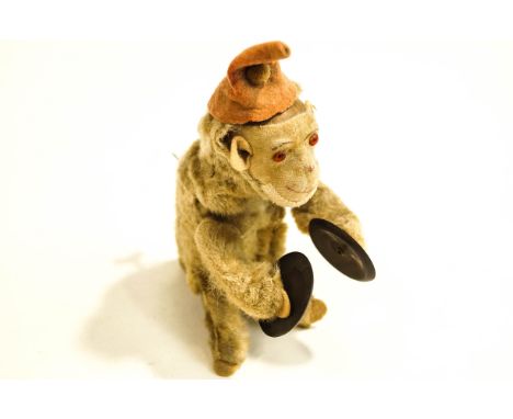 A 20th Century German clockwork toy monkey, playing cymbals