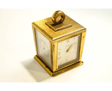 A Guardier Four Caster revolving clock, the functions comprising : a thermometer, a hydro barometer, a barometer, and a clock