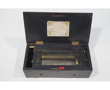 A 19th Century Swiss musical box in an ebonised case, playing six airs on a 19cm barrel case, 38cm wide