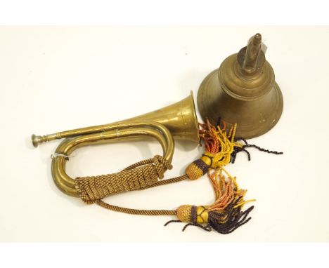 A brass bell, with clanger, 22cm high, together with a brass bugle