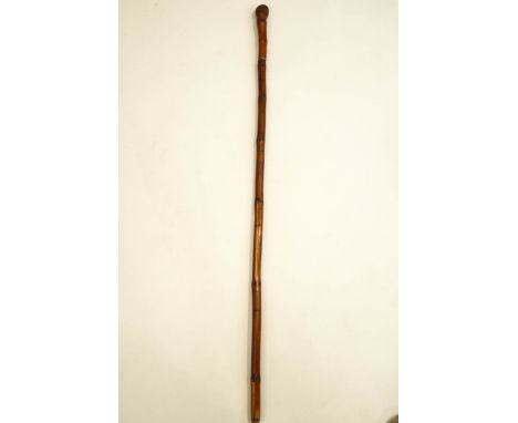 A 19th Century Japanese bamboo sword stick, with incised decorative panels of Geisha and birds