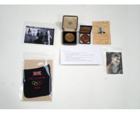 A collection of 1948 London Olympic Games memorabilia, relating to the swimming time keeper Douglas Gray, consisting of: part