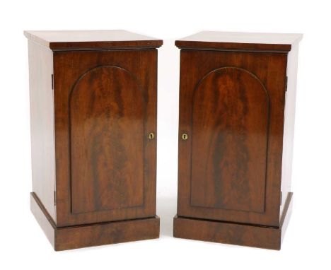 A pair of mahogany pedestal bedside cabinets, each with a slide and a shelf, 44cm wide 50.5cm deep80.5cm high (2)Condition re