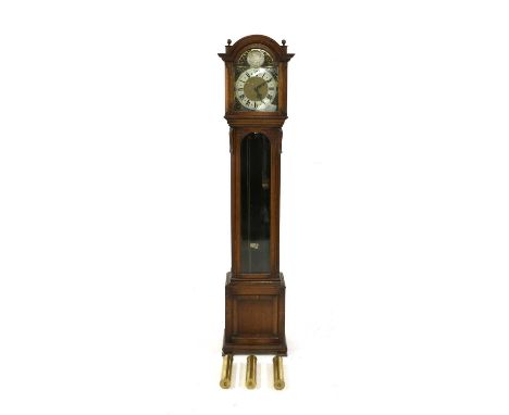 An oak longcase clock,8 day quarter chiming on gong bars, three brass cased weights and pendulum, with pull chain wind, strik