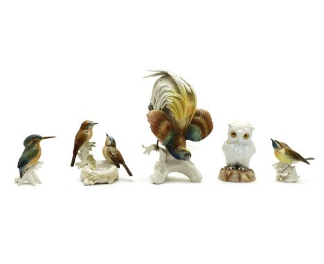 A Continental porcelain figure of a owl,19th century, fitted with glass eyes, and with scissor mark beneath,16cm high,togethe