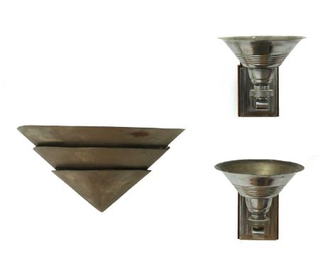 An Italian silvered metal wall light,of triple fan shape, 42.5cm wide21.5cm deep21cm high, and a pair of cast wall lights, ea