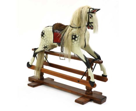A painted pine rocking horse, 20th century, with dapple grey paintwork and suede saddle, 109cm highCondition report: Used con