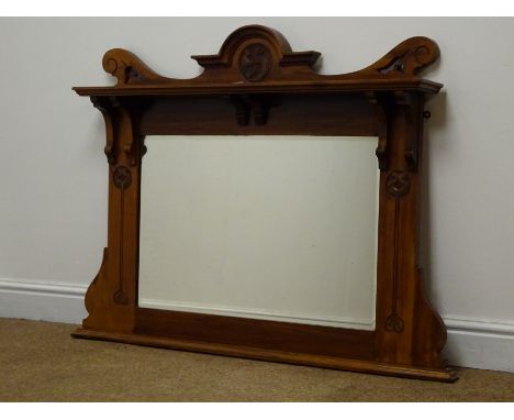 Edwardian Art Nouveau walnut overmantle mirror with top shelf and carved stylised motifs, W105cm, H86cm