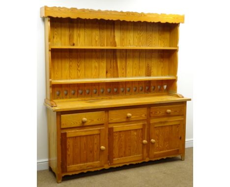 Pine kitchen dresser, with twin shelf back above three drawers and three cupboards, tapered supports, W172cm, H183cm, D45cm