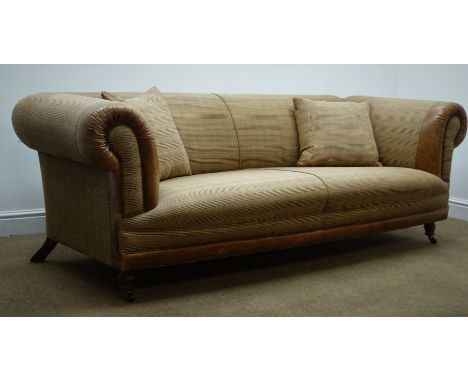 Three seat sofa, scrolled arms, upholstered in check fabric and tan leather, turned supports on castors, W216cm Condition Rep