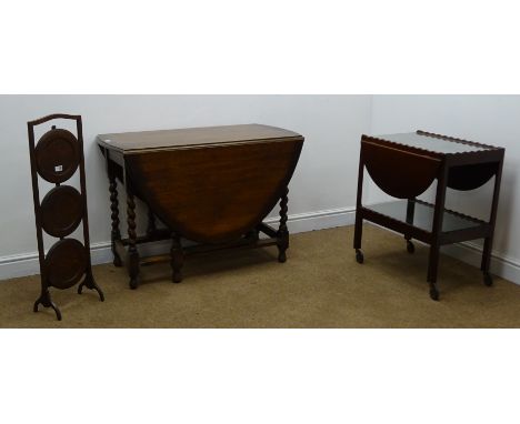 20th century oak gate leg barley twist table (W103cm, H72cm, D152cm) a mahogany drop leaf trolley and a three tier folding ca