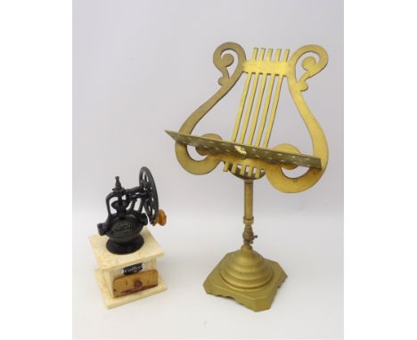Brass lyre shaped tabletop music stand and a coffee grinder
