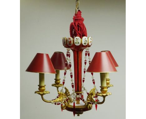 Four light gilt metal electrolier with cranberry white overlay lustre column and matching faceted ruby and clear drops, H41cm