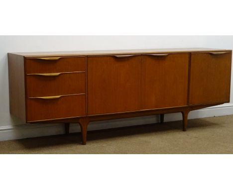 McIntosh teak sideboard, three graduating drawers, two cupboard doors enclosing a shaped shelf, single fall front unit, taper