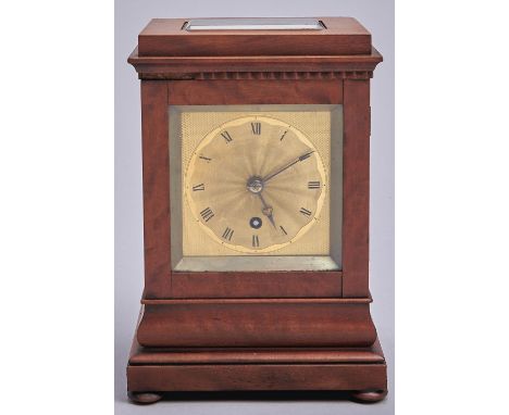 A Victorian mahogany mantel timepiece, c1840, with engine turned square gilt brass dial and steel hands, in rectangular pilla