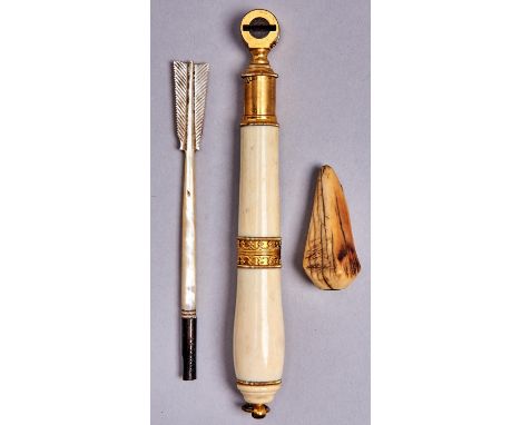 A fine French gilt brass and turned ivory handle, early 19th c, 14cm l, a Victorian bone whistle and a Victorian carved mothe