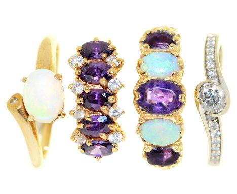 An amethyst and opal ring, in 14ct gold, size P½ and three other gem set rings, in gold, one marked 18k, the others marked 14