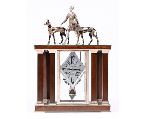 A French art deco patinated and chromium plated metal architectural mantel clock, A la Renaissance 49 Bd St Martin Paris, c19