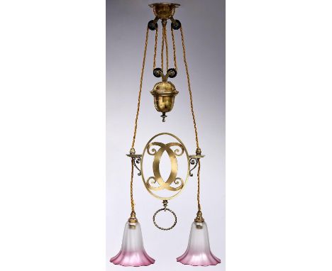 An early electric rise-and-fall electrolier, early 20th c, the rose and acorn shaped brass cased weight each with pair of bla